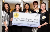 Students pose with their prize money check